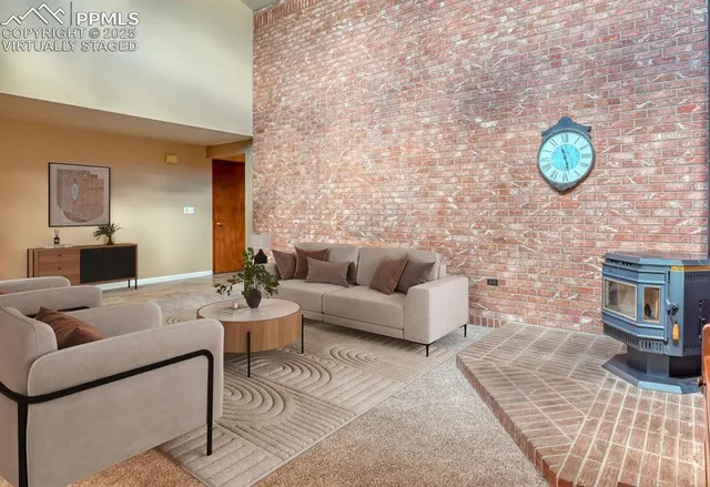 a living room with furniture and a lamp