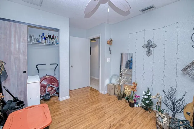 a bedroom with bed and a closet