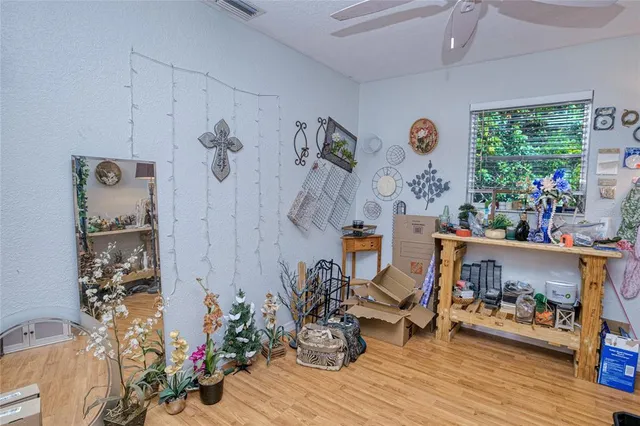 a work room with furniture and wooden floor