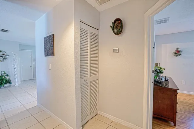 a view of a hallway with closet
