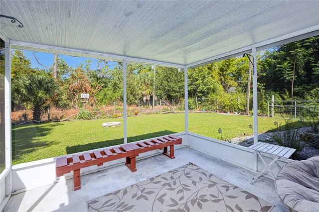 a view of swimming pool with a back yard