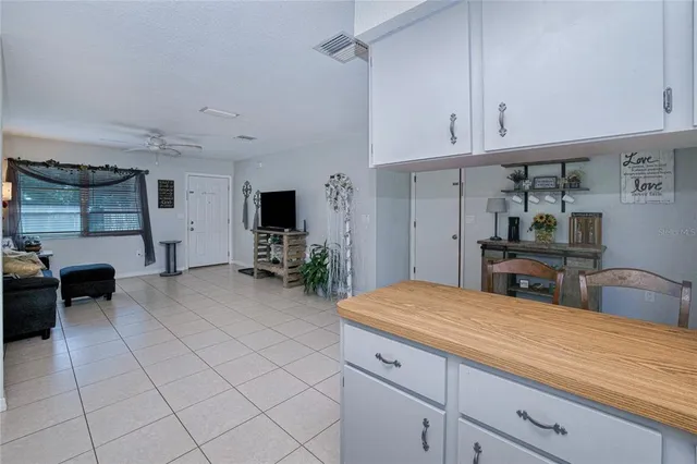 a kitchen with sink and cabinets