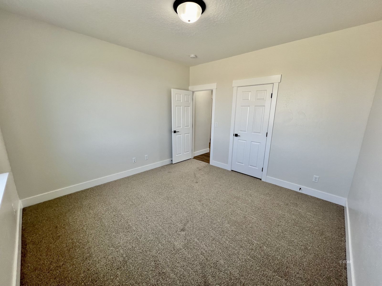 610 Ridgeway Drive Spring Creek, NV 89815 - Photo 13 of 33 a view of an empty room and wooden floor