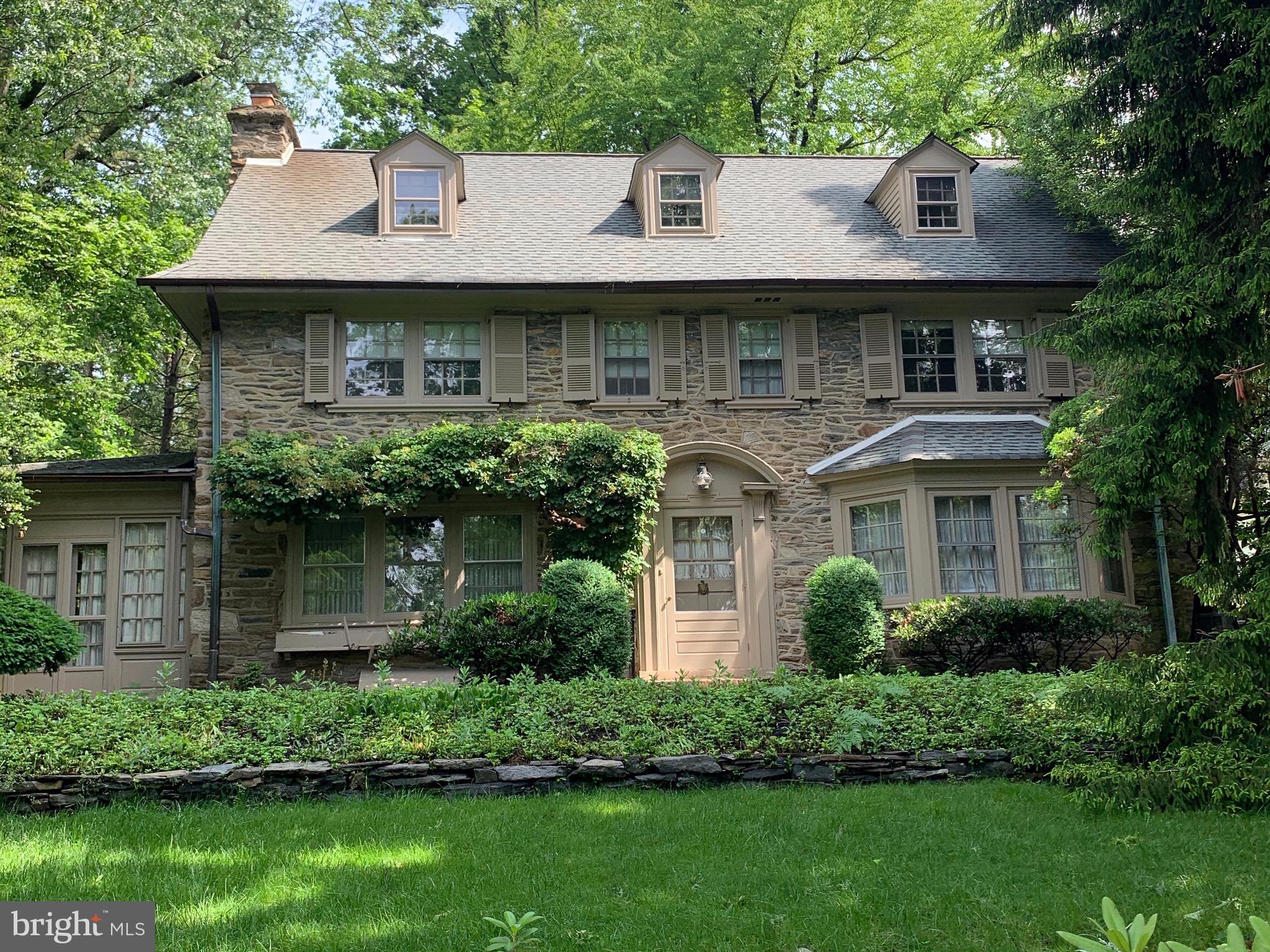 315 Kent Road Wynnewood, PA 19096 - Photo 1 of 19 a front view of a house with a garden