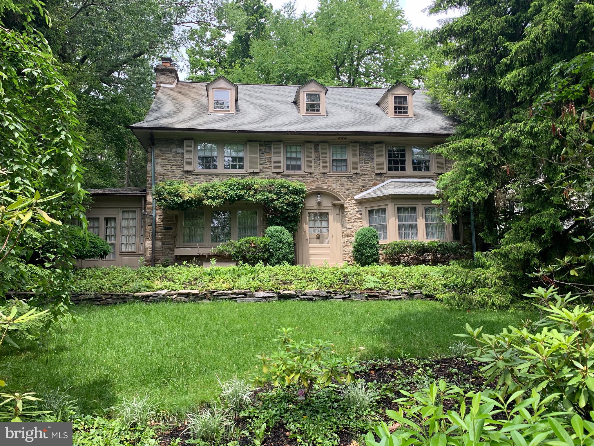 315 Kent Road Wynnewood, PA 19096 - Photo 19 of 19 a front view of a house with a yard and trees
