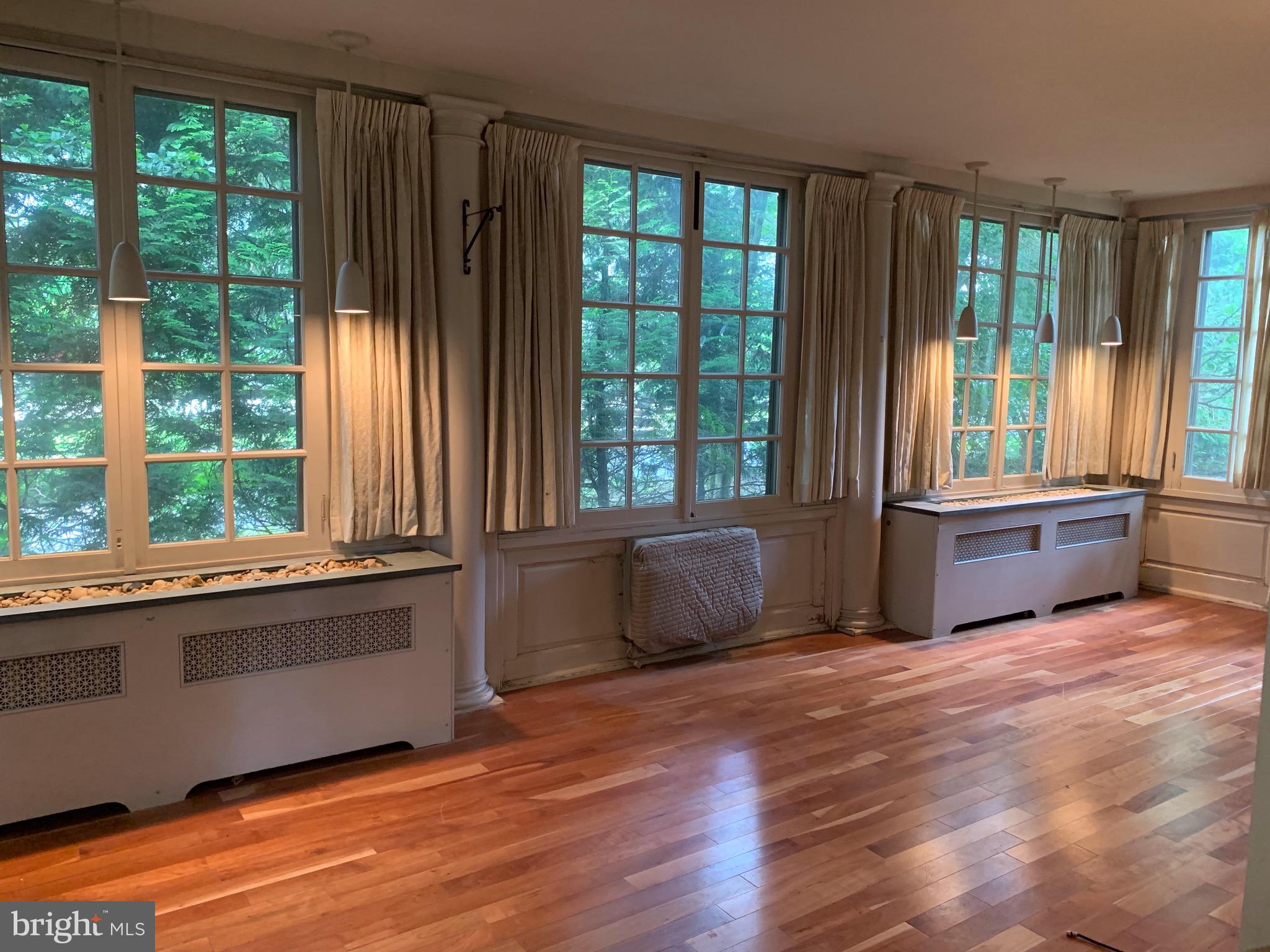 315 Kent Road Wynnewood, PA 19096 - Photo 6 of 19 a living room with furniture and large windows