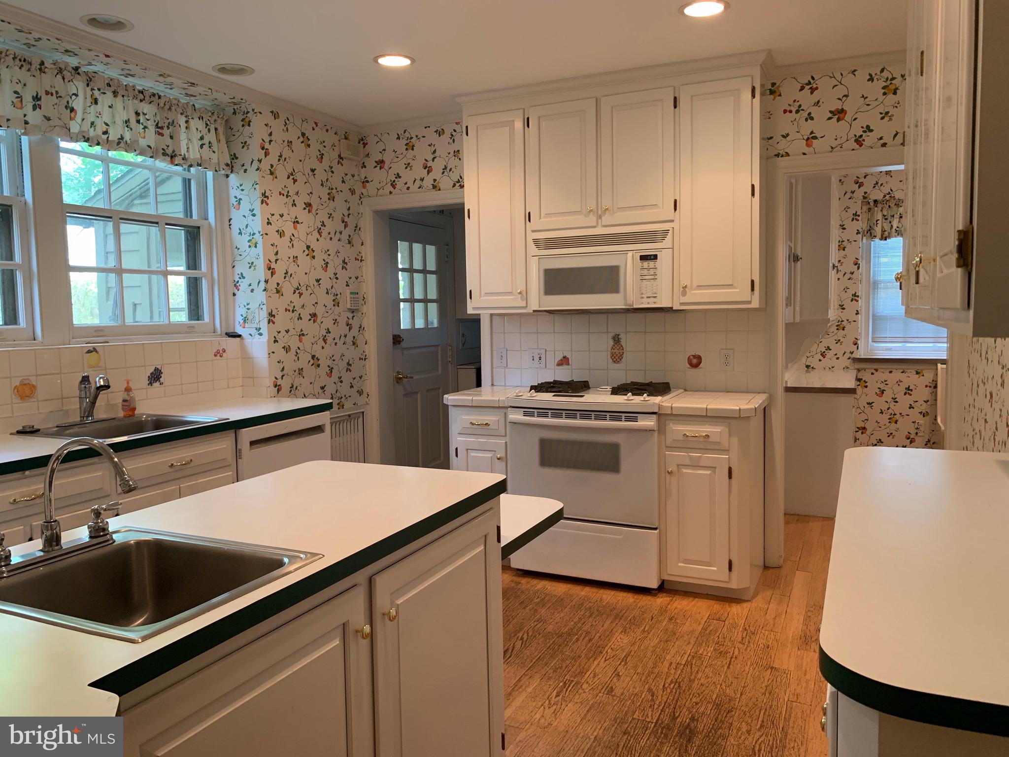 315 Kent Road Wynnewood, PA 19096 - Photo 10 of 19 a kitchen that has a sink and a stove in it