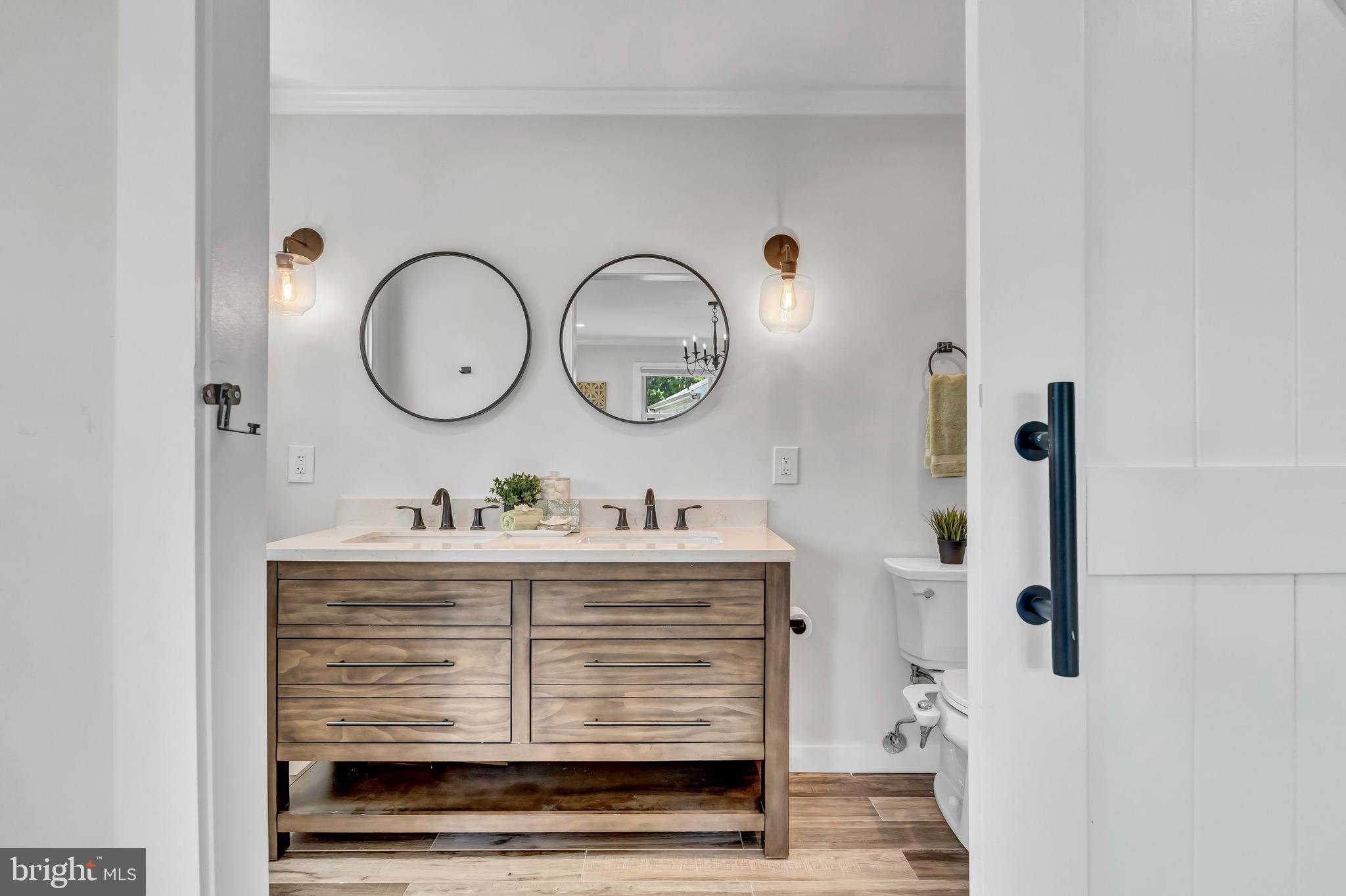 2416 Rocky Branch Road Vienna, VA 22181 - Photo 51 of 69 Custom sliding barn doors on upstairs baths.