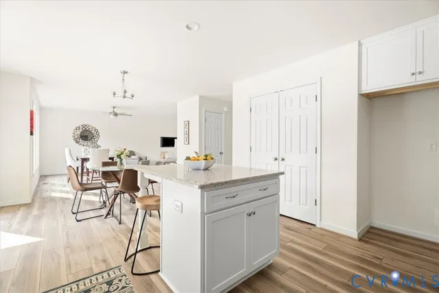 a view of a kitchen with table and chairs