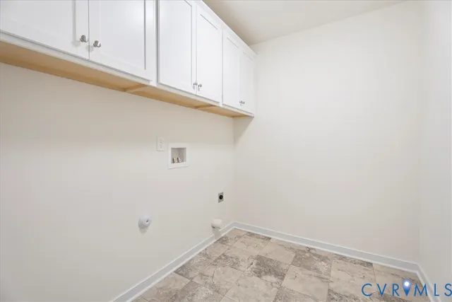 a view of room with white cabinets
