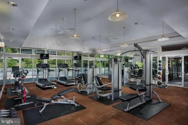 a bathroom with a toilet mirror and sink
