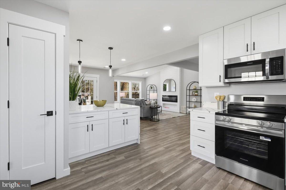 4529 Flintstone Road Alexandria, VA 22306 - Photo 21 of 37 Modern kitchen with sleek finishes.