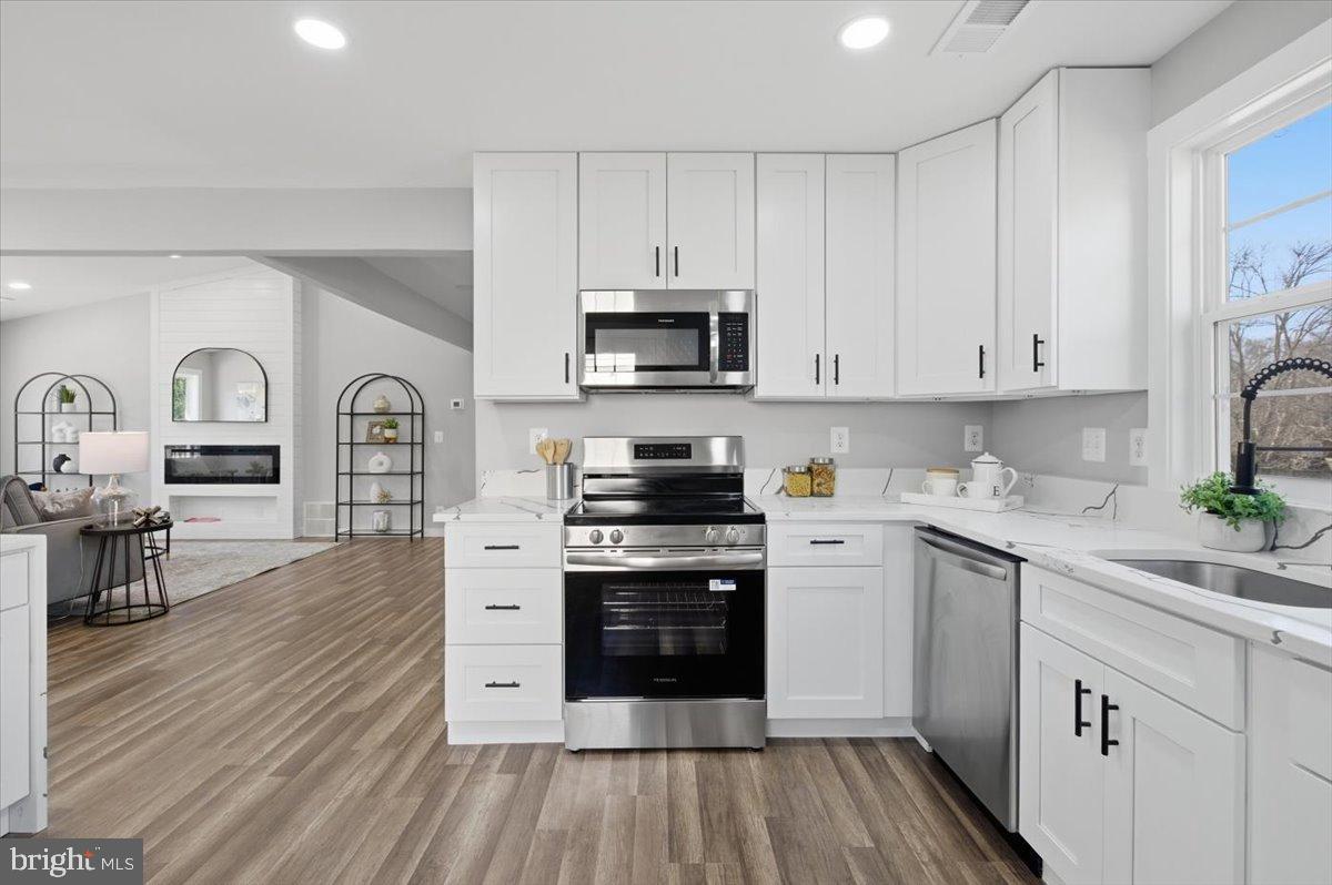4529 Flintstone Road Alexandria, VA 22306 - Photo 22 of 37 Modern kitchen with sleek finishes.