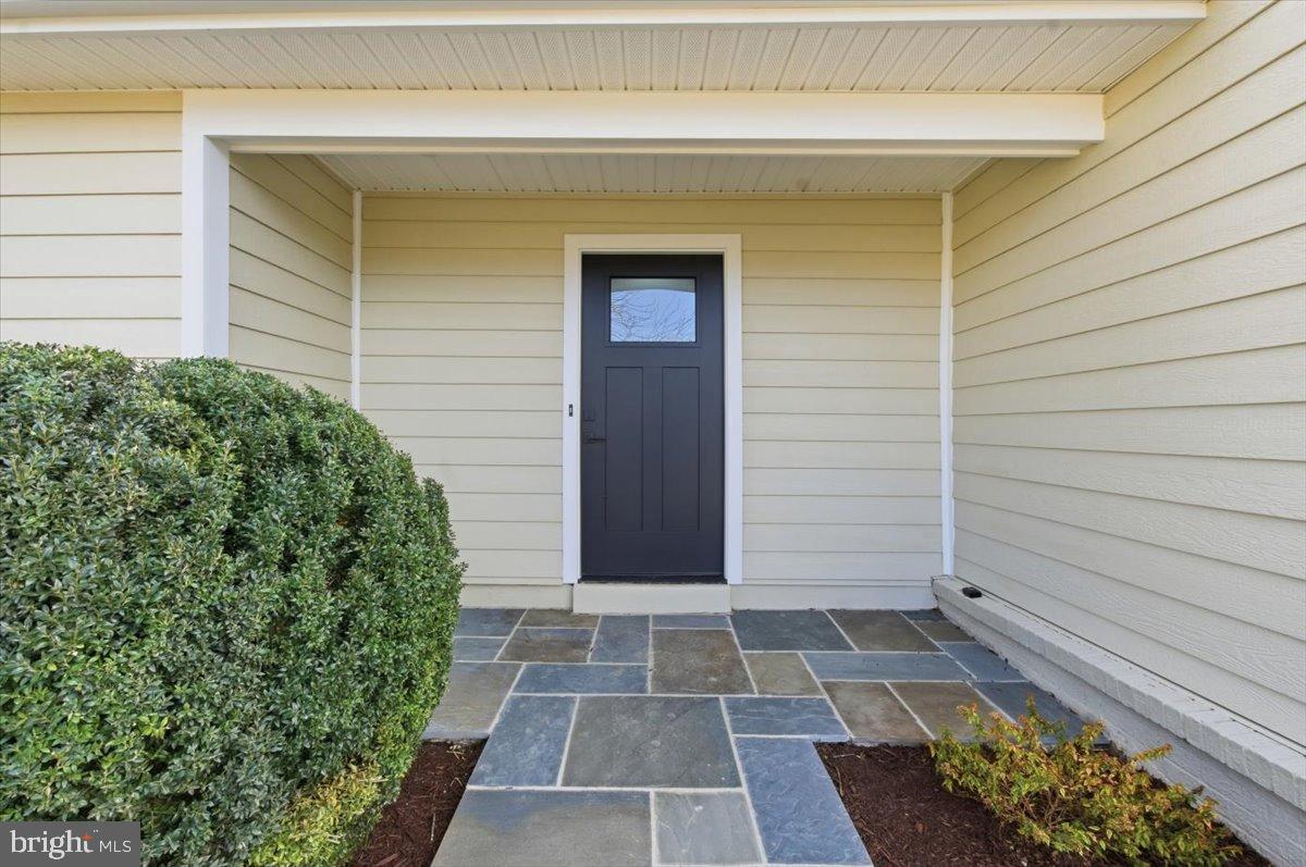 4529 Flintstone Road Alexandria, VA 22306 - Photo 4 of 37 Inviting entrance with stylish stone pathway.