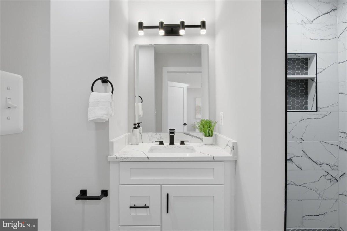 4529 Flintstone Road Alexandria, VA 22306 - Photo 6 of 37 Sleek modern bathroom with elegant finishes.
