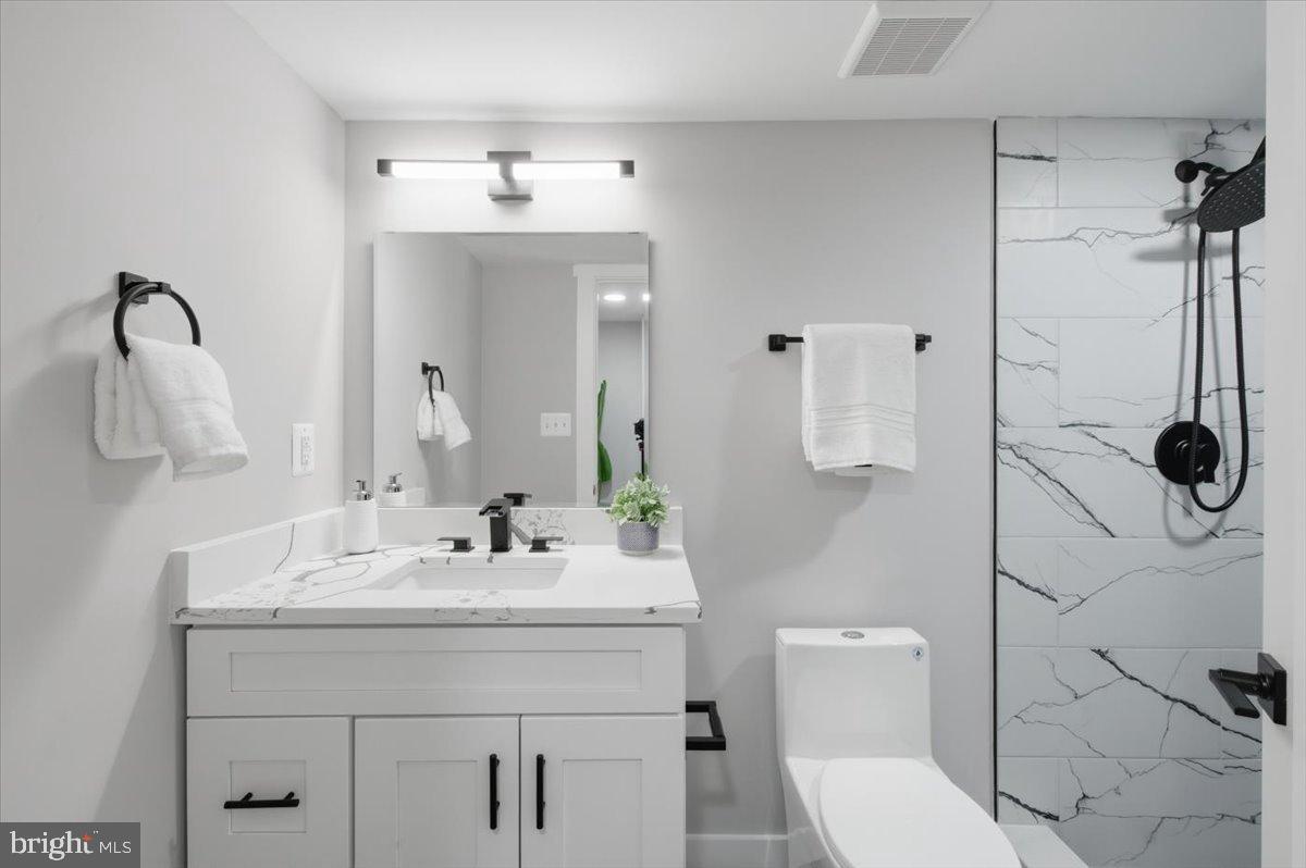4529 Flintstone Road Alexandria, VA 22306 - Photo 8 of 37 Sleek modern bathroom with elegant finishes.