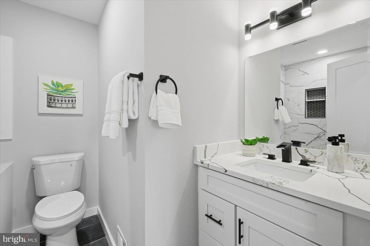 4529 Flintstone Road Alexandria, VA 22306 - Photo 10 of 37 Sleek modern bathroom with elegant finishes.