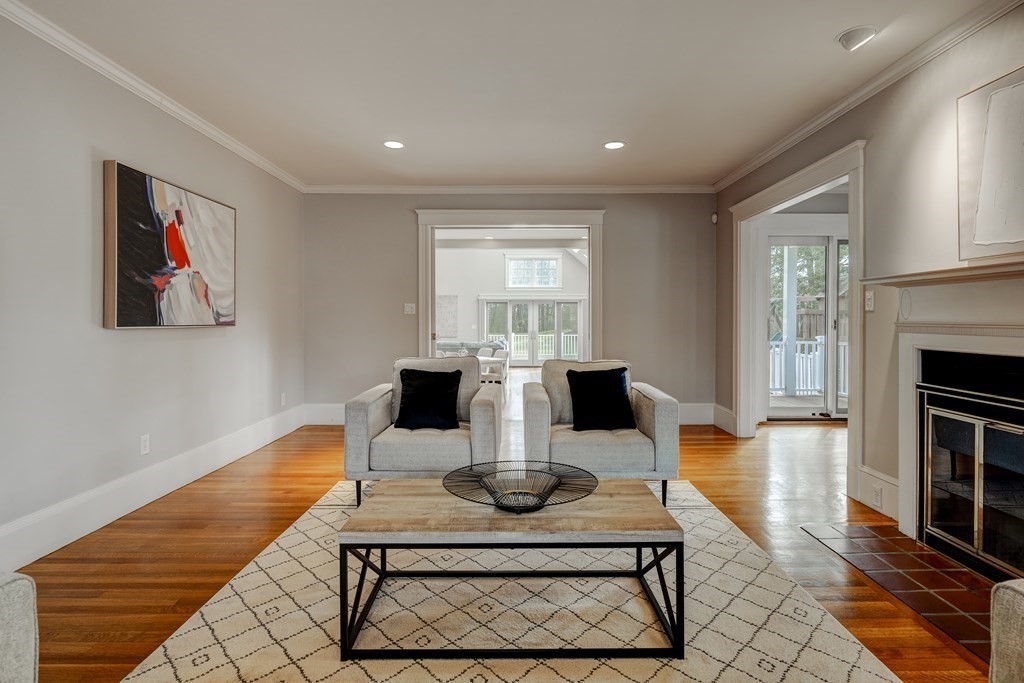 200 Chapman Street Canton, MA 02021 - Photo 16 of 42 a living room with dining table a dining table with kitchen view