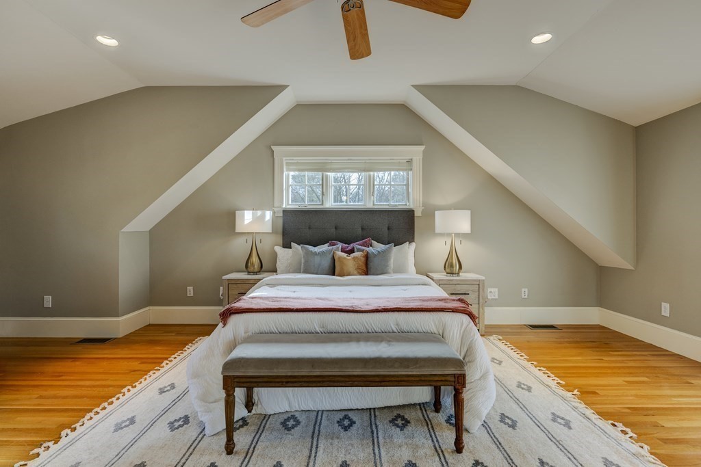 200 Chapman Street Canton, MA 02021 - Photo 19 of 42 a bedroom with a bed and a chandelier