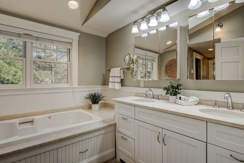 200 Chapman Street Canton, MA 02021 - Photo 23 of 42 a bathroom with a sink and a mirror