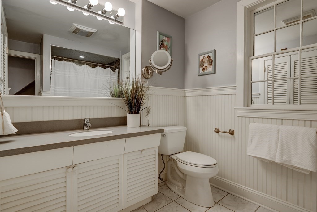 200 Chapman Street Canton, MA 02021 - Photo 26 of 42 a bathroom with a toilet a sink and mirror