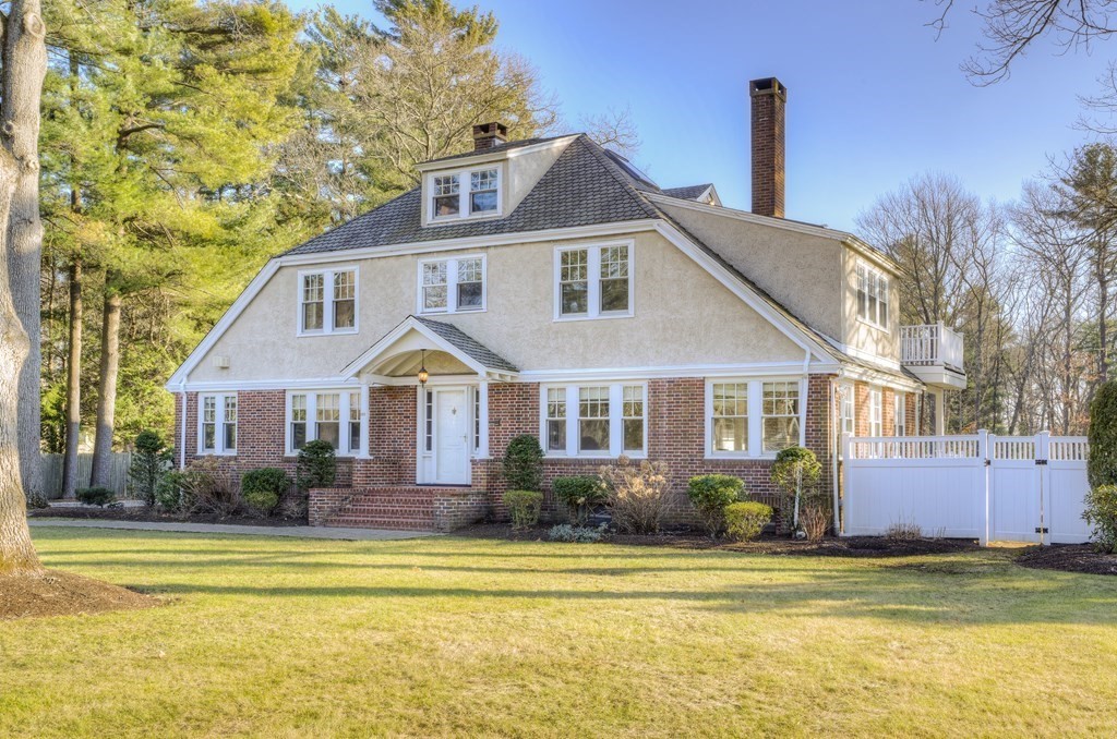 200 Chapman Street Canton, MA 02021 - Photo 3 of 42 a front view of a house with a garden and lake view