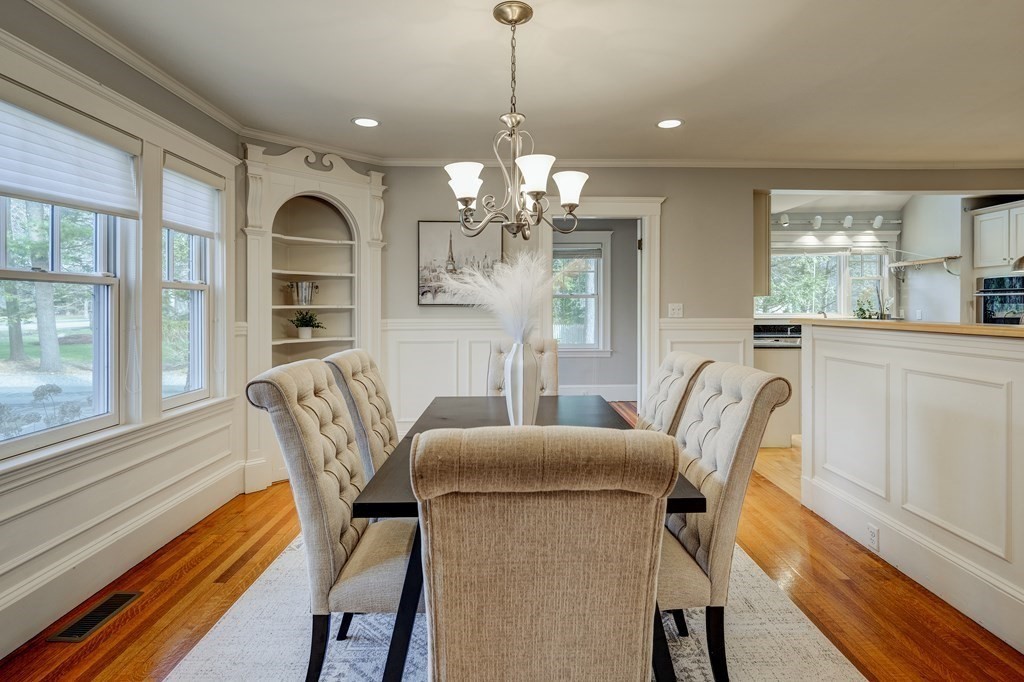 200 Chapman Street Canton, MA 02021 - Photo 10 of 42 a view of a dining room with furniture wooden floor and chandelier