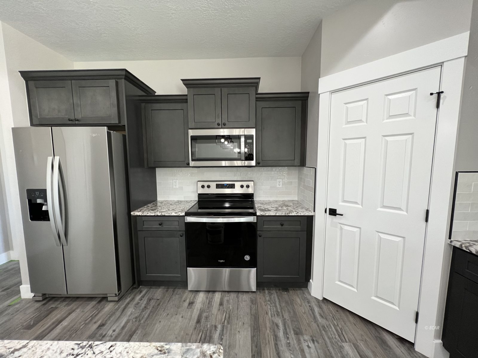 1265 Sun Vly Road Spring Creek, NV 89815 - Photo 11 of 34 a kitchen with stainless steel appliances a refrigerator and a stove top oven