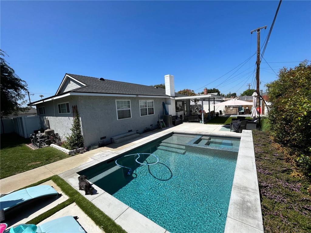 1805 West Random Drive Anaheim, CA 92804 - Photo 12 of 46 a view of a house with a swimming pool