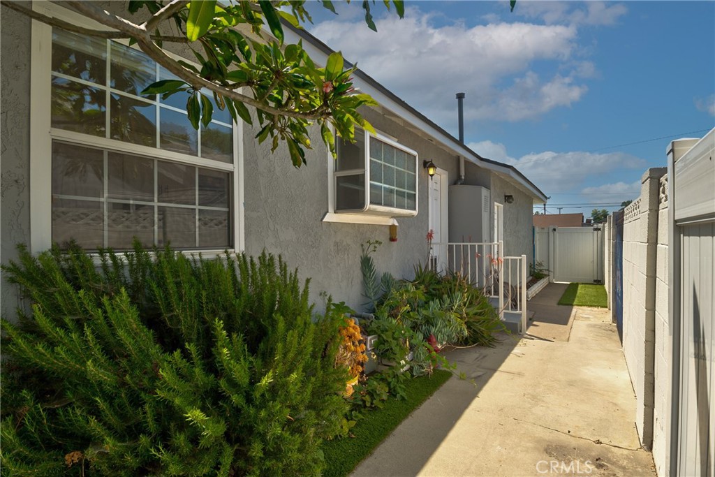 1805 West Random Drive Anaheim, CA 92804 - Photo 22 of 46 a front view of a house with a yard