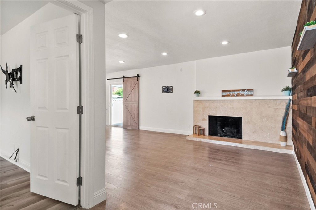 1805 West Random Drive Anaheim, CA 92804 - Photo 25 of 46 a view of a hallway with wooden floor and a fireplace