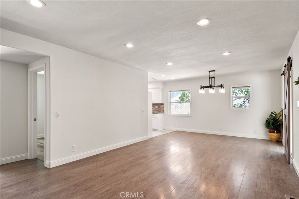 1805 West Random Drive Anaheim, CA 92804 - Photo 27 of 46 an empty room with wooden floor and windows