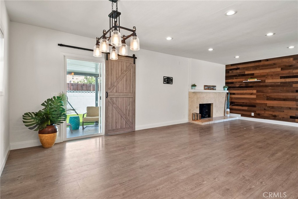 1805 West Random Drive Anaheim, CA 92804 - Photo 29 of 46 a view of an empty room with a window and wooden floor