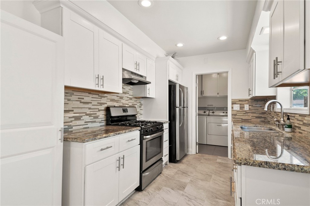 1805 West Random Drive Anaheim, CA 92804 - Photo 30 of 46 a kitchen with a sink stainless steel appliances and cabinets