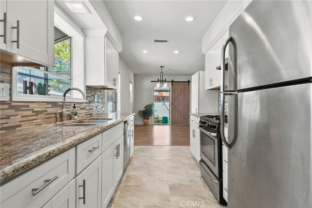 1805 West Random Drive Anaheim, CA 92804 - Photo 34 of 46 a large kitchen with a large window and stainless steel appliances