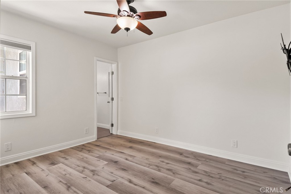 1805 West Random Drive Anaheim, CA 92804 - Photo 35 of 46 an empty room with wooden floor closet and windows
