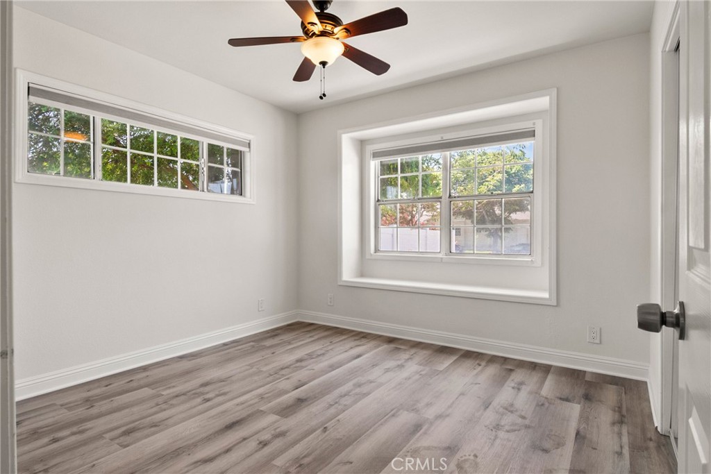 1805 West Random Drive Anaheim, CA 92804 - Photo 41 of 46 a view of an empty room with a window and wooden floor