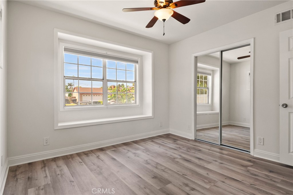 1805 West Random Drive Anaheim, CA 92804 - Photo 42 of 46 a view of an empty room with a window and wooden floor
