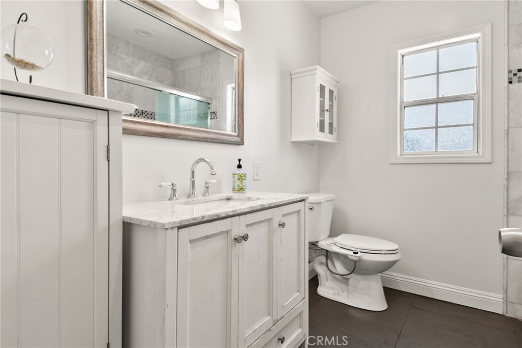 1805 West Random Drive Anaheim, CA 92804 - Photo 45 of 46 a bathroom with a toilet sink and mirror