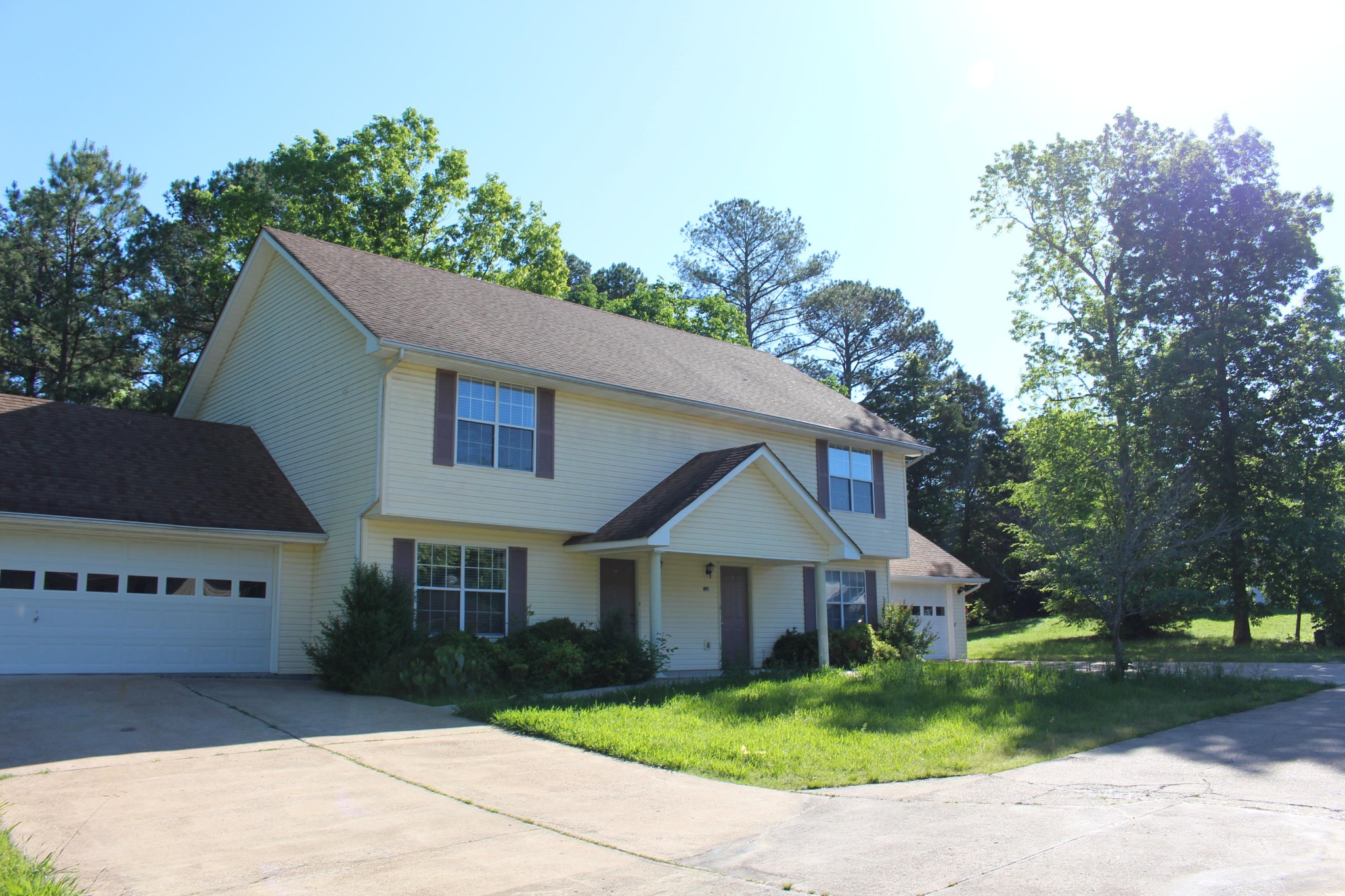 2133 Jenkins Road Chattanooga, TN 37421 - Photo 1 of 10 a front view of a house with a garden and trees