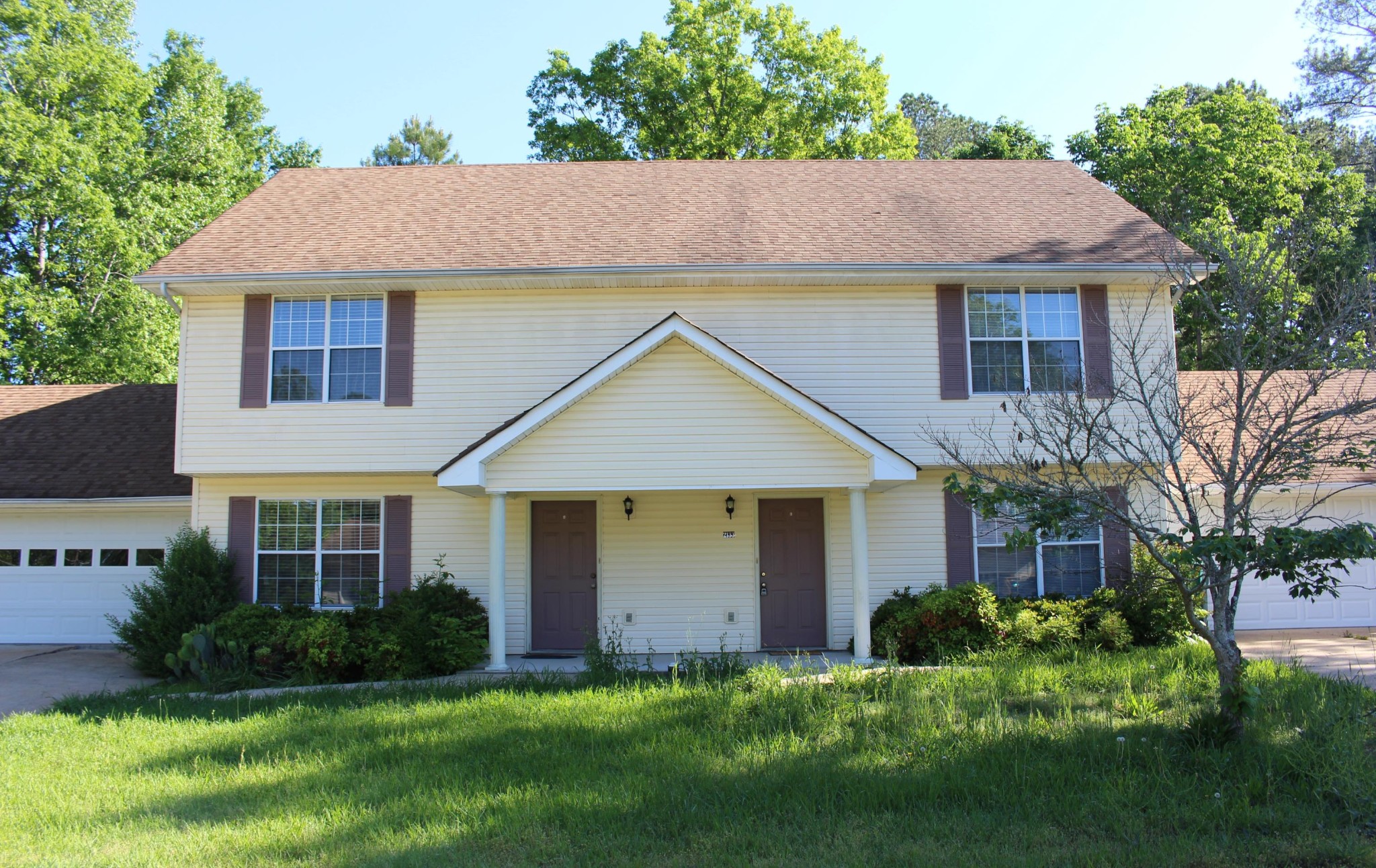 2133 Jenkins Road Chattanooga, TN 37421 - Photo 2 of 10 a front view of a house with a yard and garage