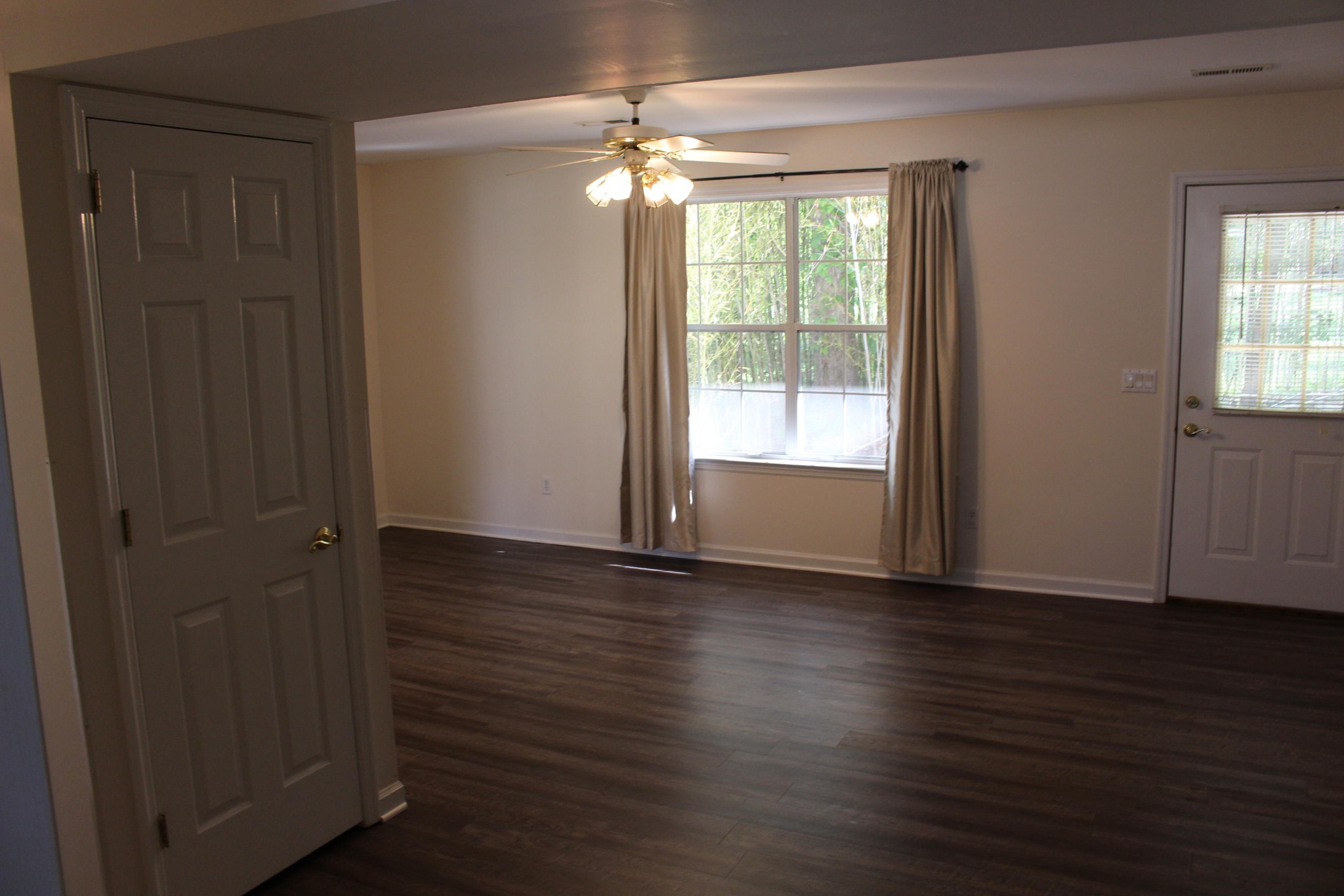 2133 Jenkins Road Chattanooga, TN 37421 - Photo 7 of 10 an empty room with wooden floor and windows
