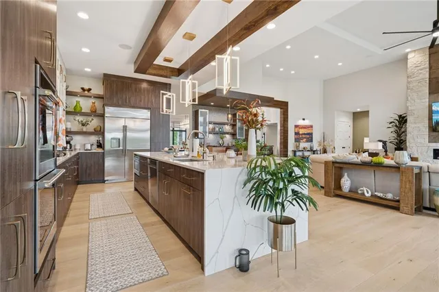 a kitchen with counter top space and stainless steel appliances