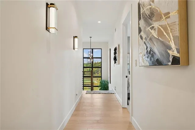 a view of a hallway with windows