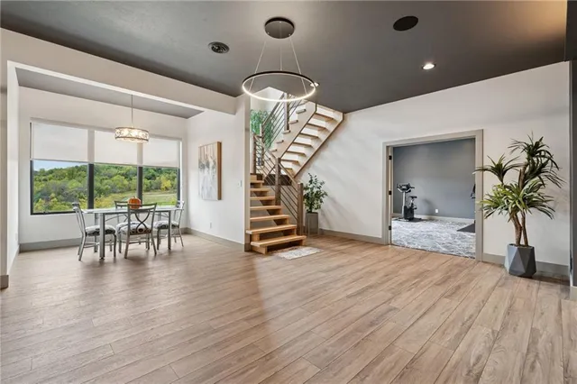 a view of dining room with furniture window and wooden floor