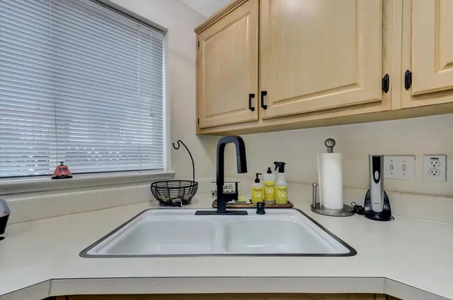 a kitchen with a sink and a window