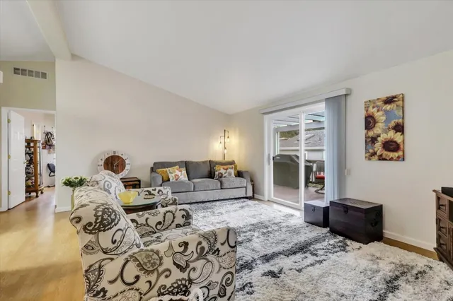 a living room with furniture window and wooden floor