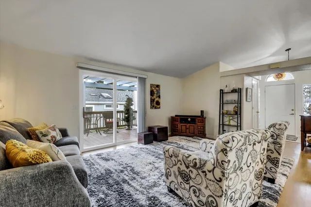 a bedroom with a large bed and a couch