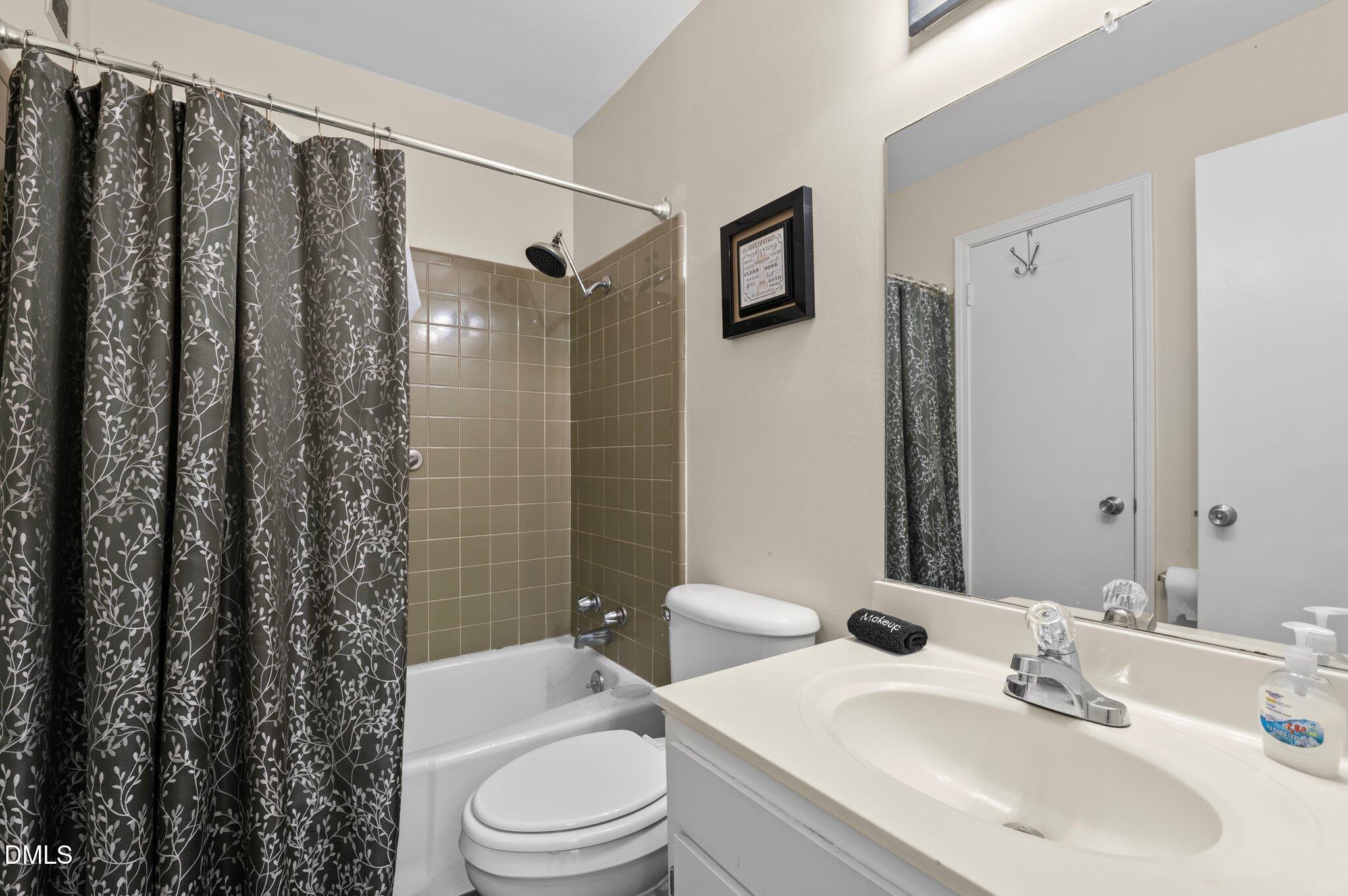 807 West Trinity Avenue, Unit 153 Durham, NC 27701 - Photo 12 of 39 a bathroom with a sink toilet and shower