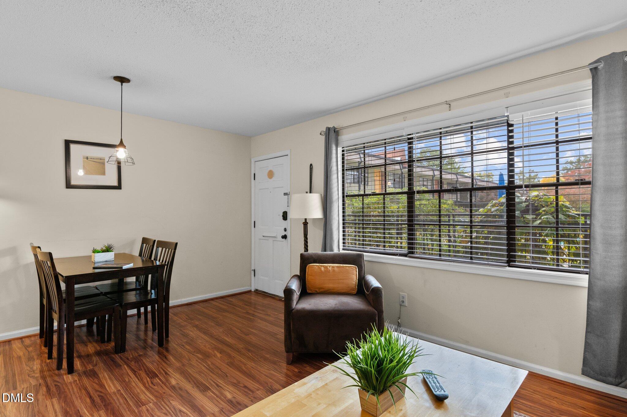 807 West Trinity Avenue, Unit 153 Durham, NC 27701 - Photo 7 of 39 a living room with furniture and a potted plant